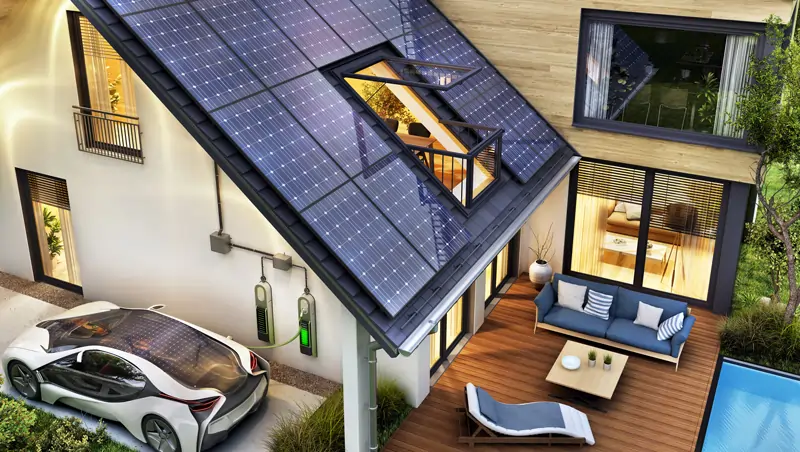 Hausansicht mit Solaranlage, Wechselrichter, Batteriespeicher und einer Aufladestation für das E-Auto. Ausgestattet mit einem Pool und einer Terasse.